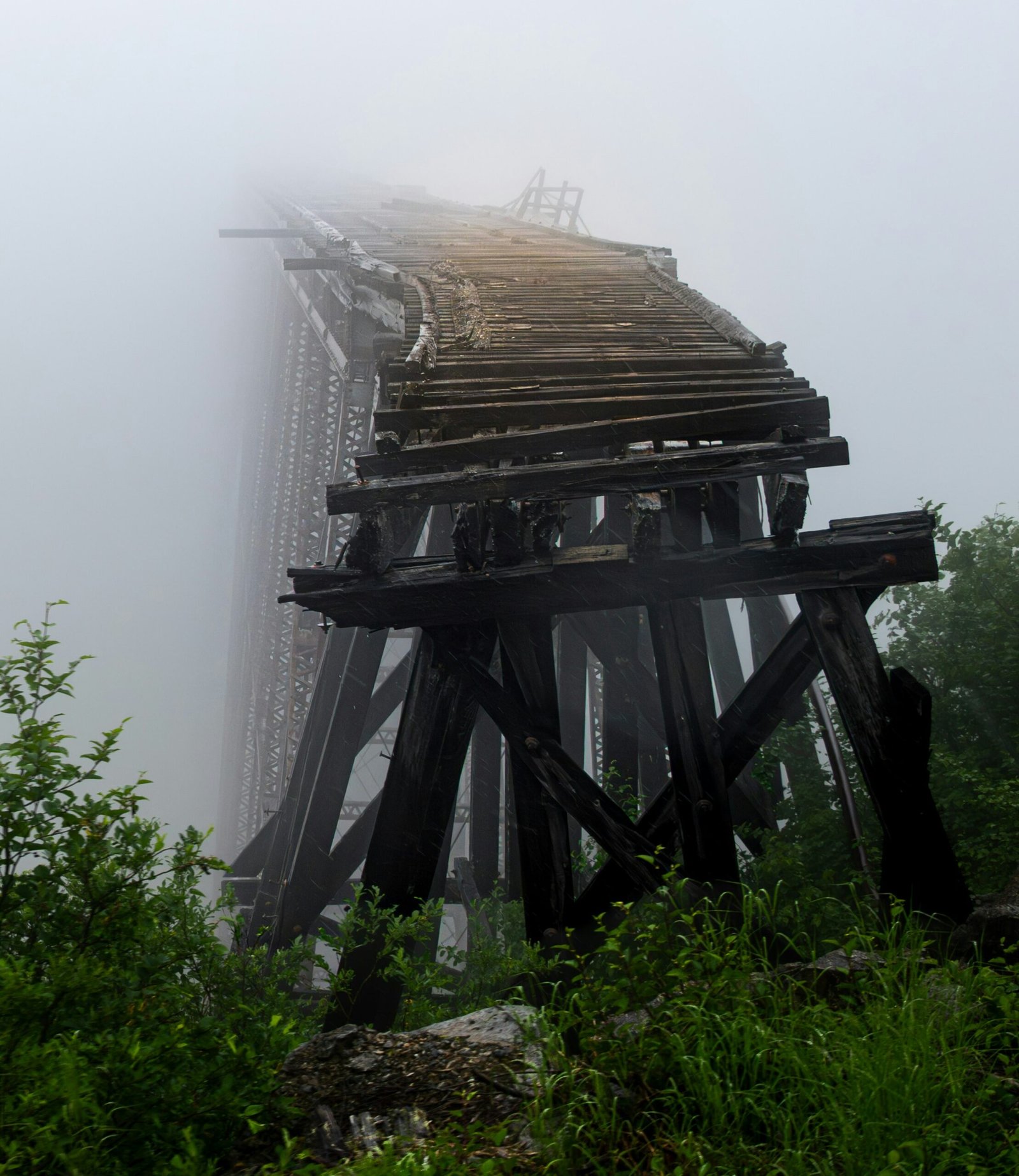 A train bridge in the fog on a foggy day